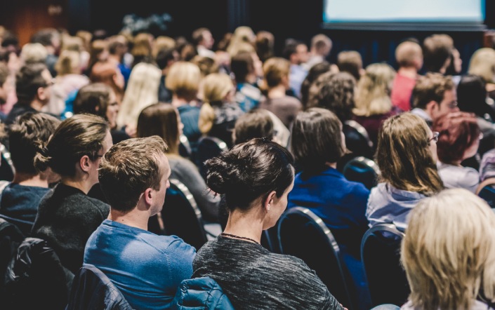 Audience in a busy conference hall